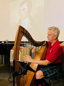 Eyler playing the Celtic Harp for the Burns Supper